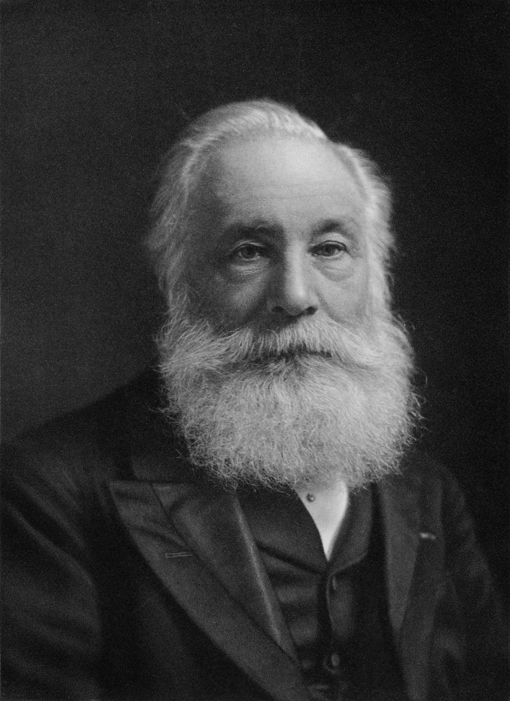 Black-and-white photographic portrait of William Perkin, with a moustache and a dark suit.